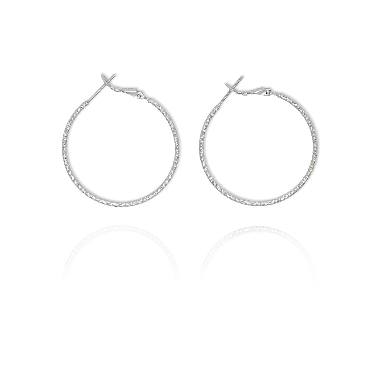 A pair of large thin hoop earrings in silver color.