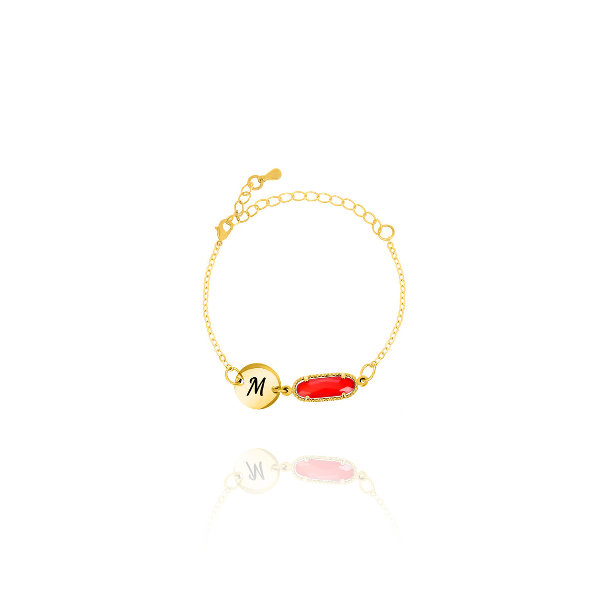 Gold-tone bracelet with engraved M initial disc and red faceted rectangular stone in a beaded frame on white background