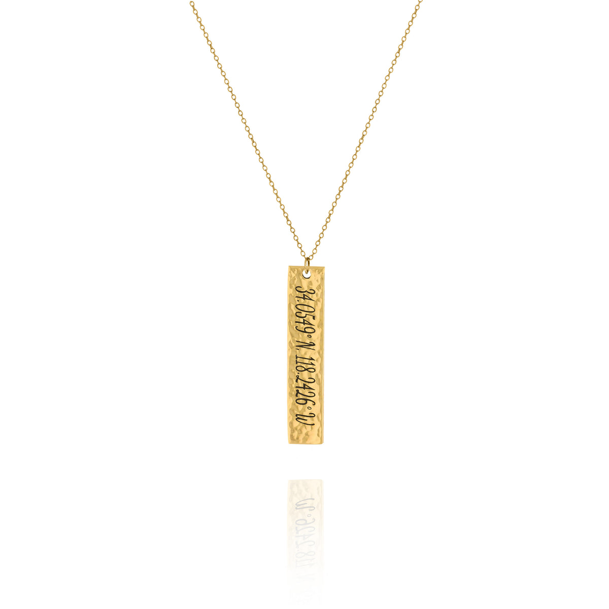 A personalized hammered vertical bar necklace in gold tone, with engraved text, displayed on a white background.