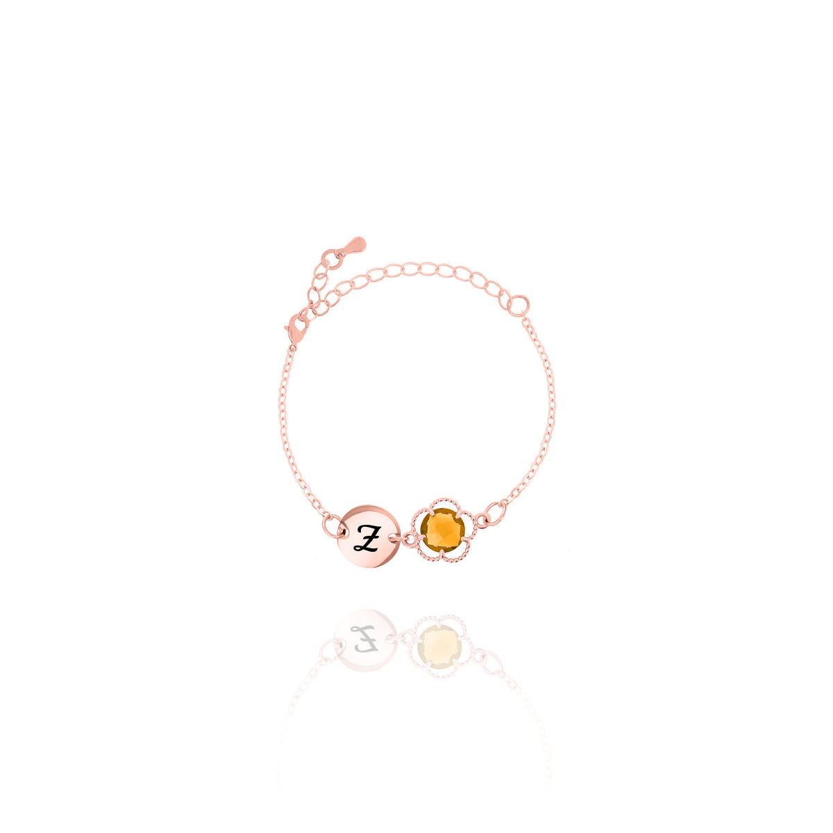 Rose-gold-tone bracelet with engraved Z initial disc and amber round stone in a beaded frame on white background