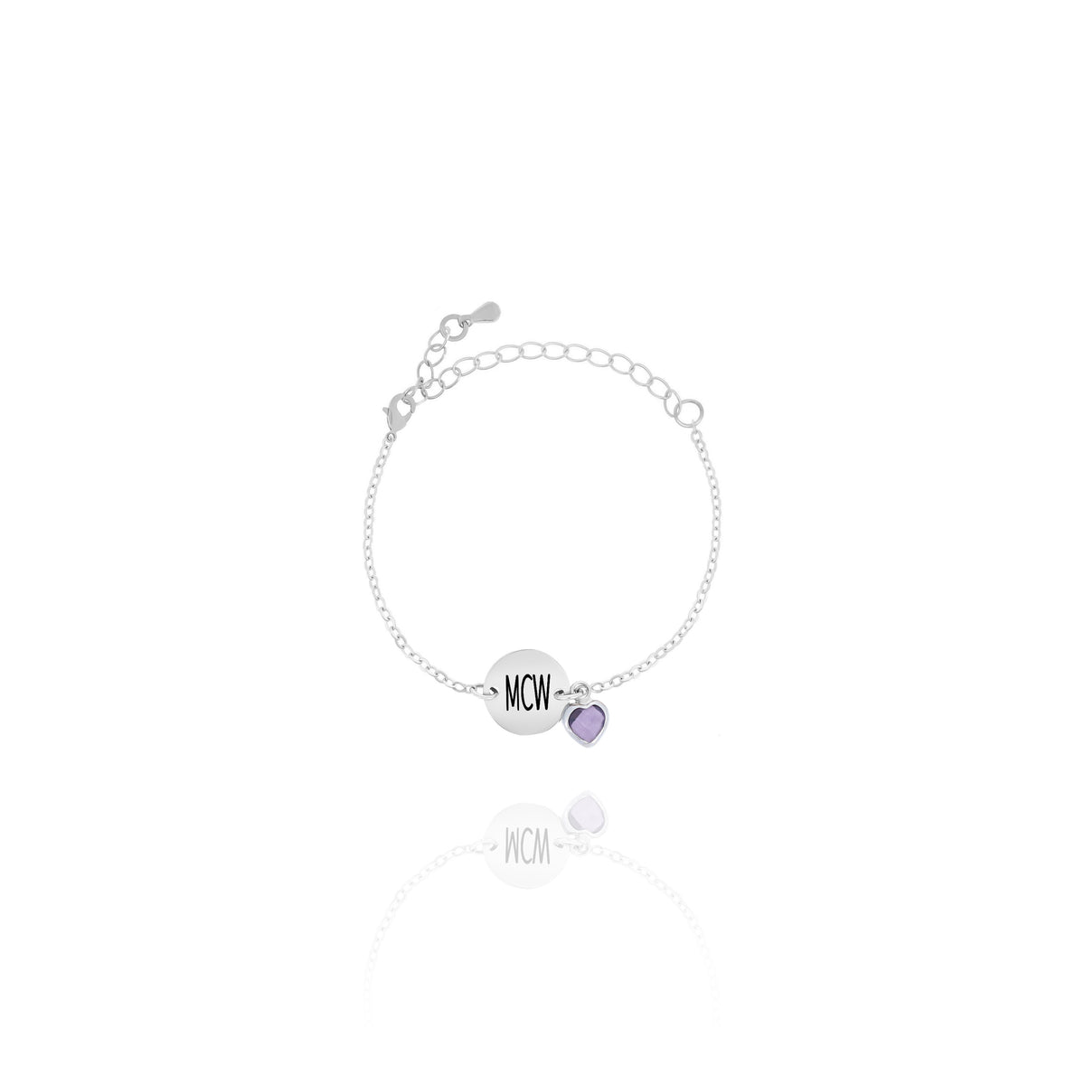 Silver-tone bracelet with engraved MCM disc and purple faceted stone charm on white background